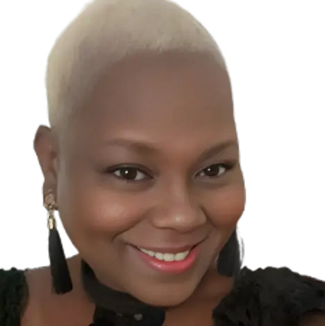 Smiling woman with short blonde hair and dangling earrings.