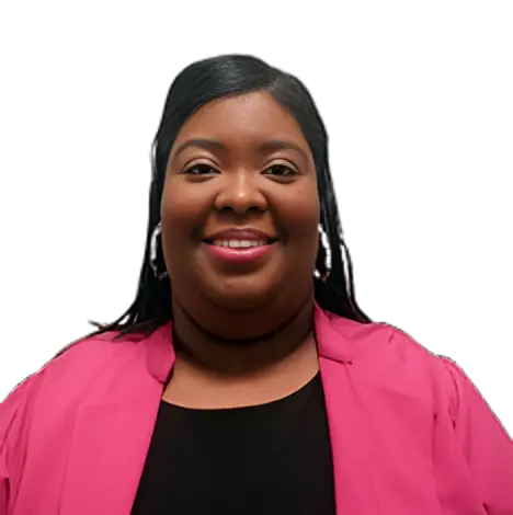 Smiling woman wearing a pink blazer and black top.
