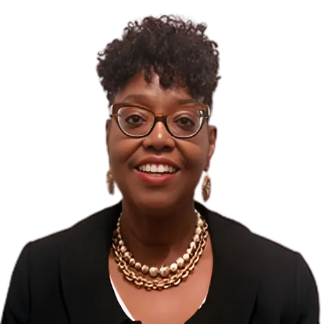 Smiling woman with glasses and layered pearl necklace.